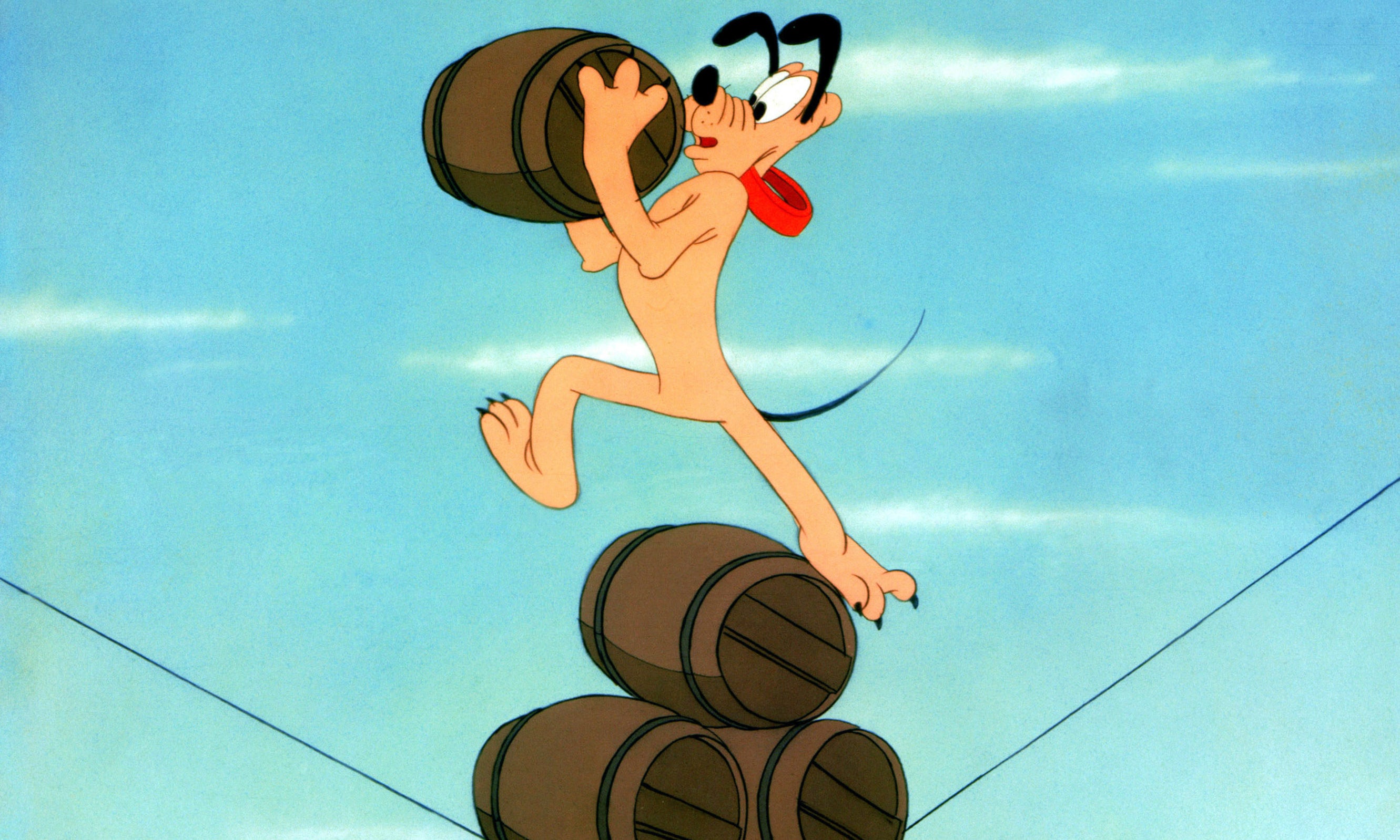 Pluto carries one barrel with his front legs while standing on three more barrels with his hind legs