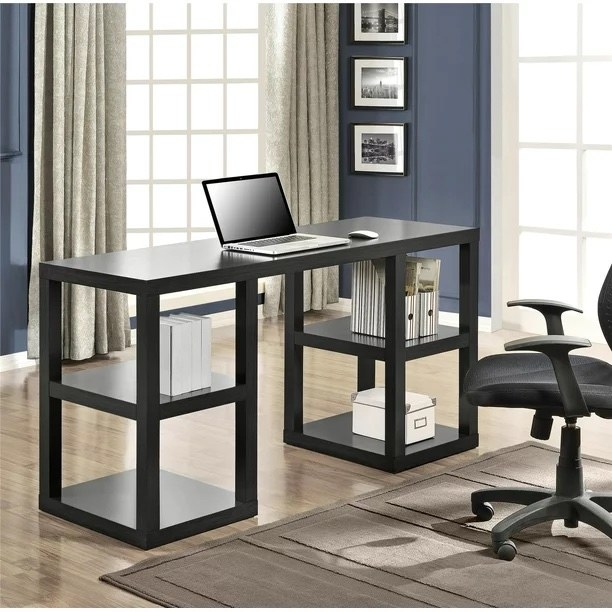 a black double pedestal desk in a home office