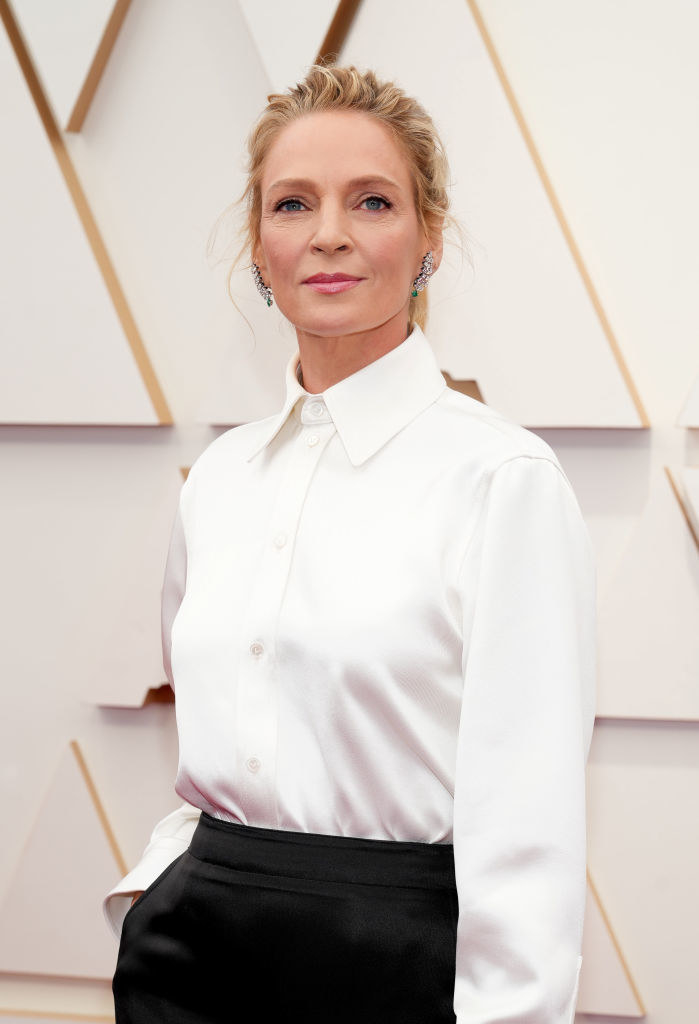 Uma in a long-sleeved blouse on the red carpet