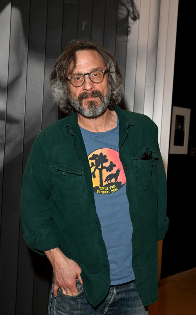 Marc Maron standing with his hand in his pocket
