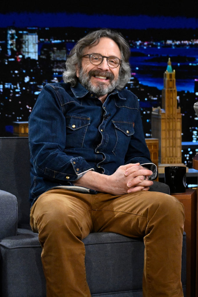 Marc Maron smiling on a talk show