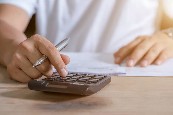 a person using a calculator