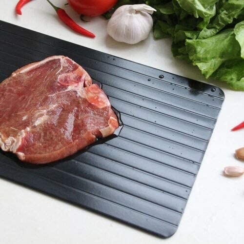 Meat on defrosting tray