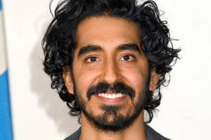 Dev Patel is pictured smiling at a movie screening in London in 2019