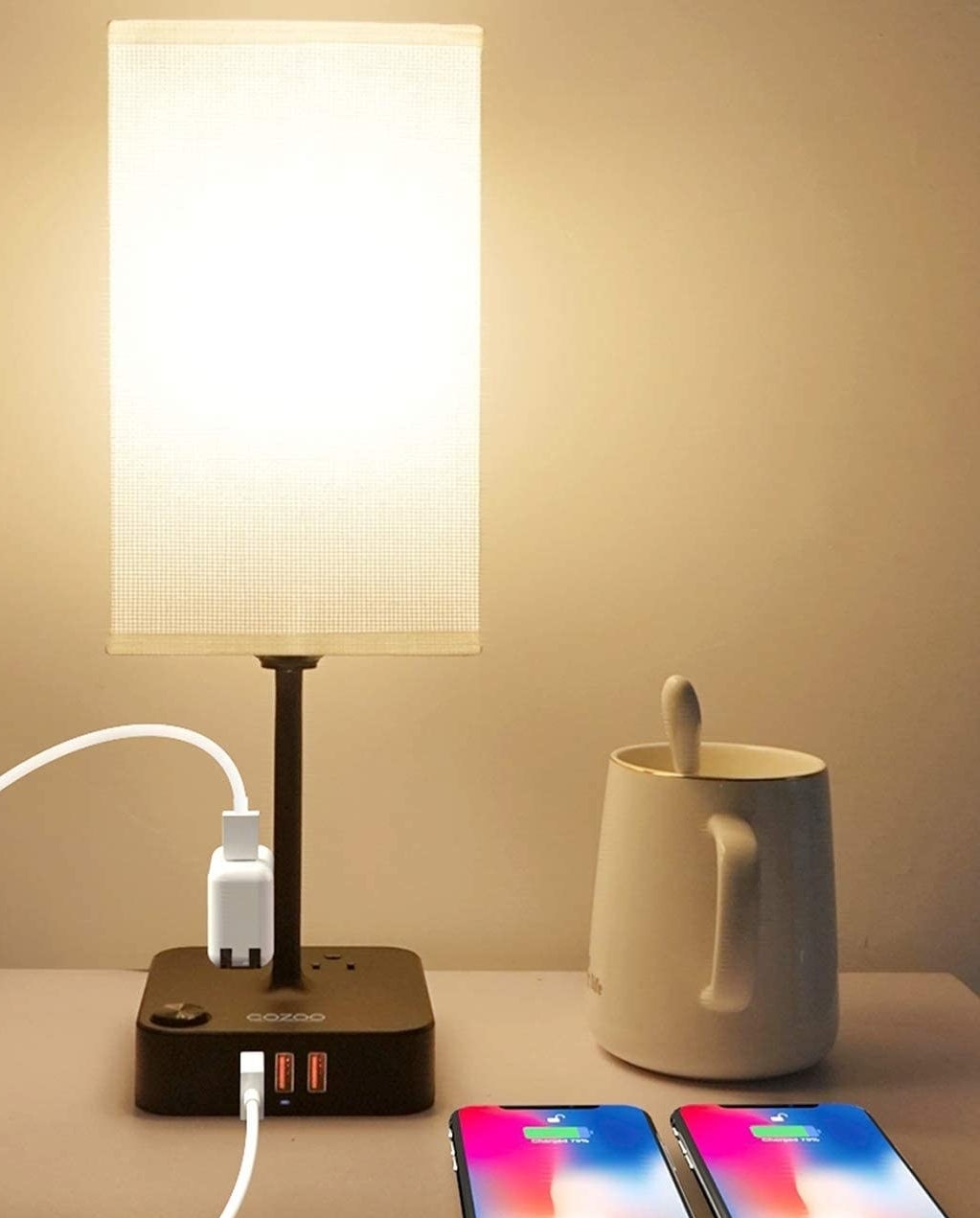 a table lamp with a base you can plug your devices into