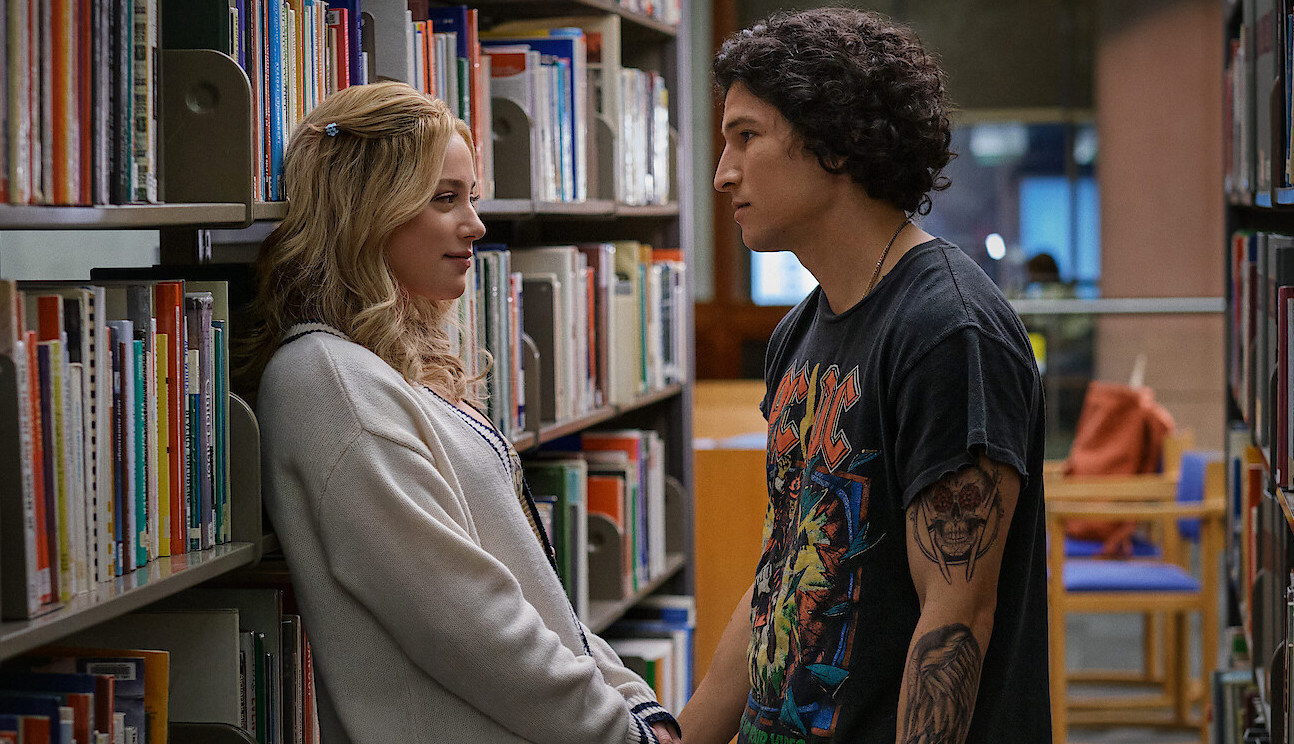 Lili Reinhart as Natalie and Danny Ramirez in a library together in &quot;Look Both Ways&quot;