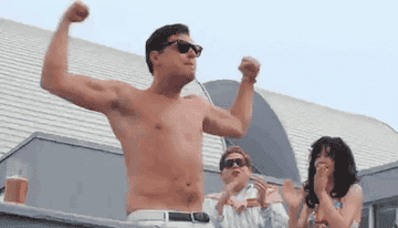 a gif of leonardo dicaprio cheering and flexing his arms
