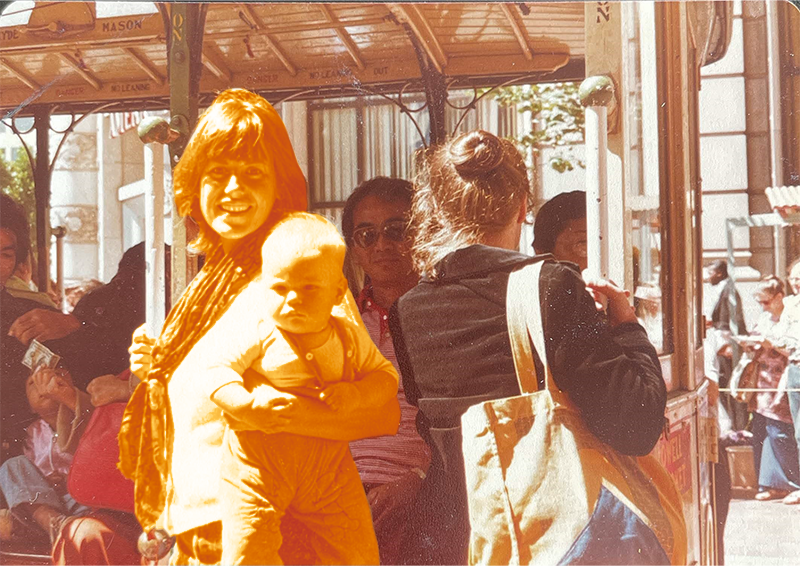 Bernardine Dohrn holding baby Zayd on a trolley