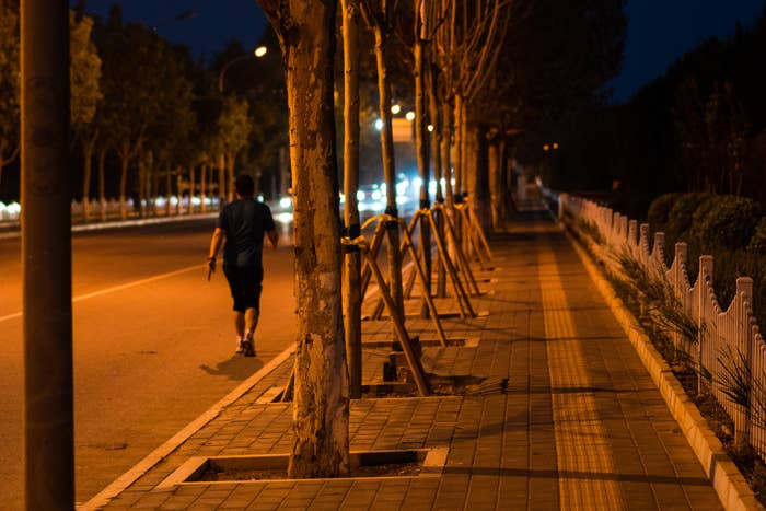 a person walking alone at night