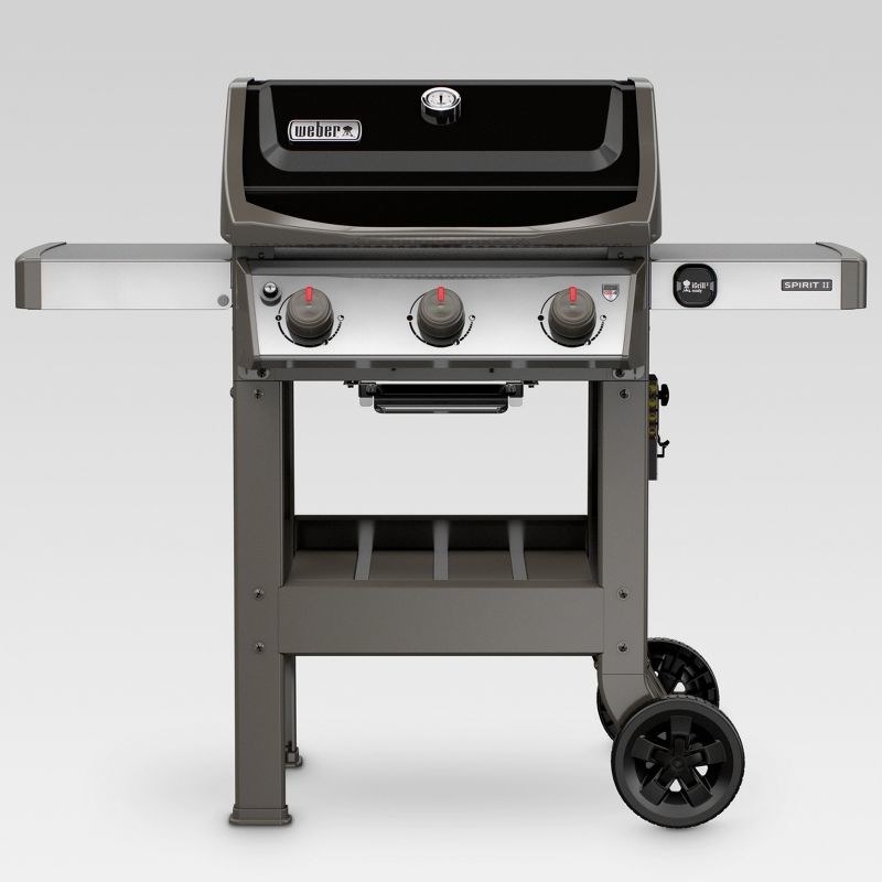 a black and silver gas grill