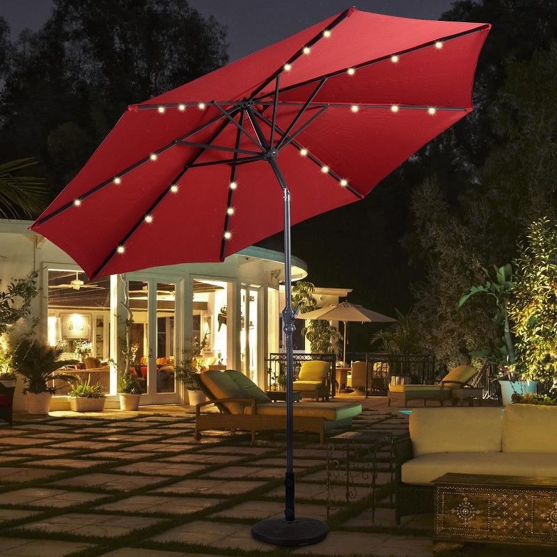 a red patio umbrella displaying LED lights
