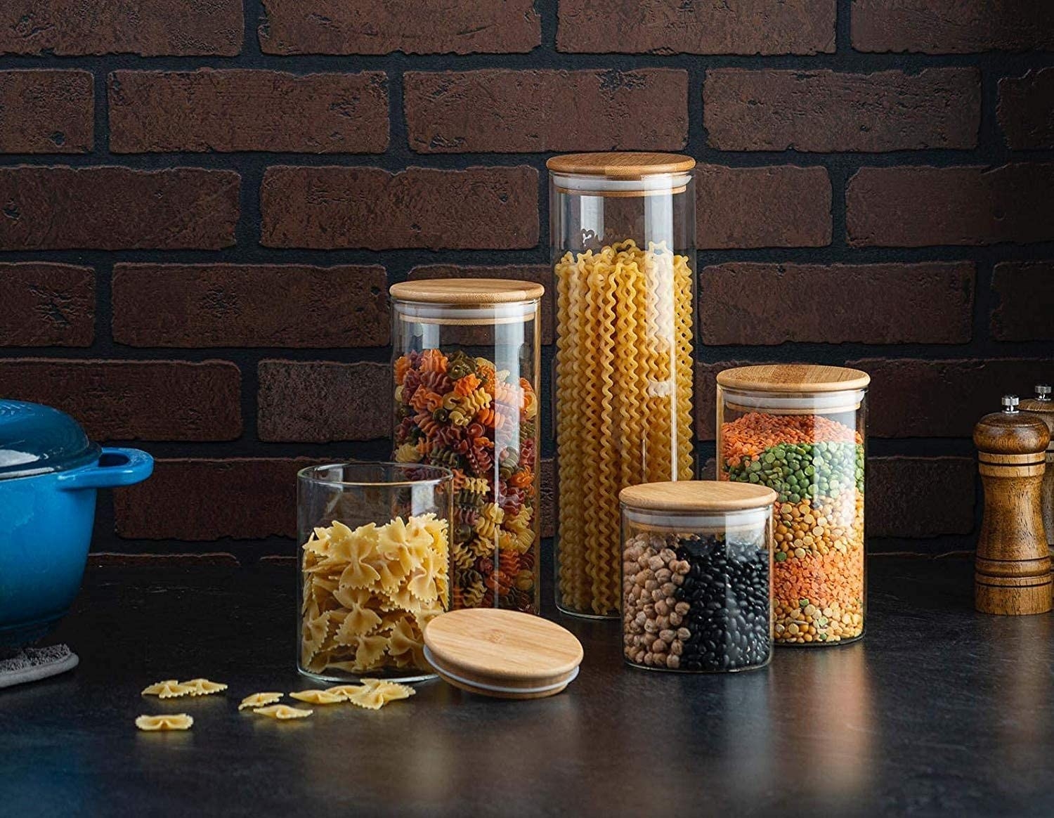 the canisters filled with dried goods like pasta and beans