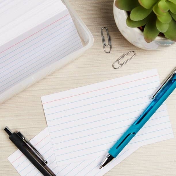 White index cards with pens laying on top