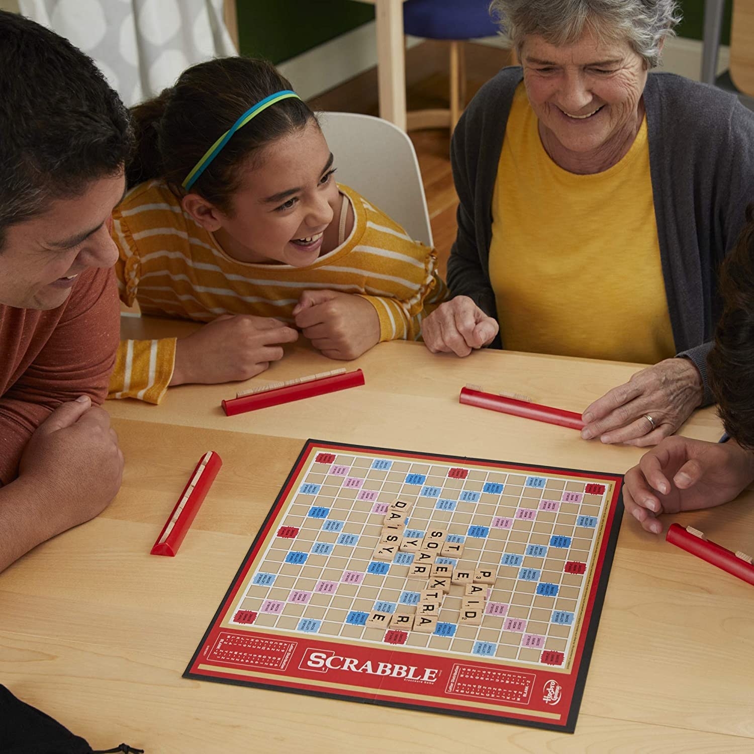 a family playing scrabble