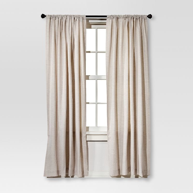 Two of the curtain in cream on a window
