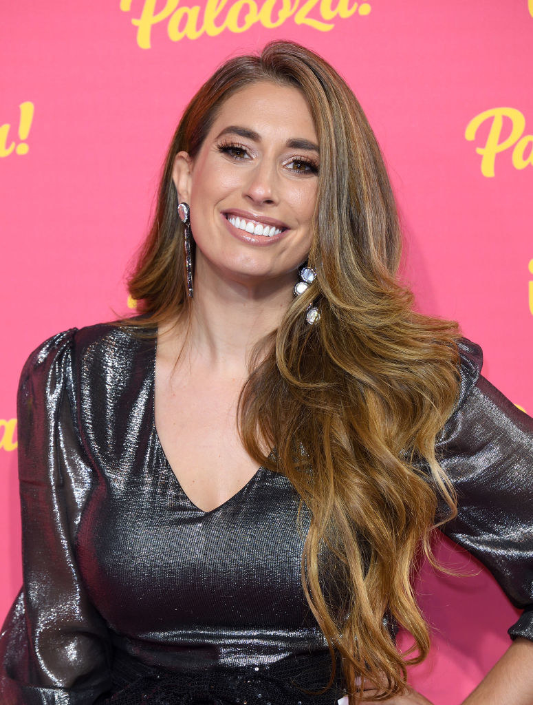 Stacey Solomon posing for a photograph with a pink Palooza backdrop