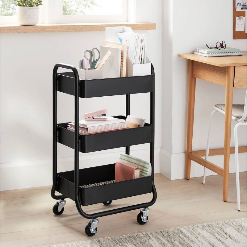 The cart in black holding desk supplies