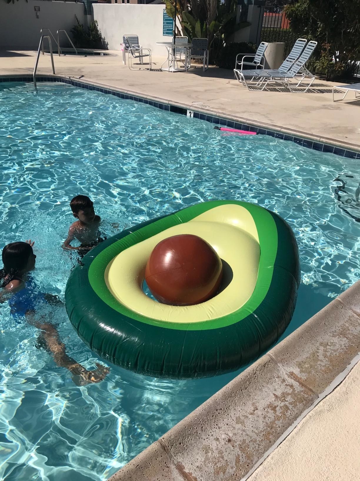 Reviewer image of avocado float in a pool