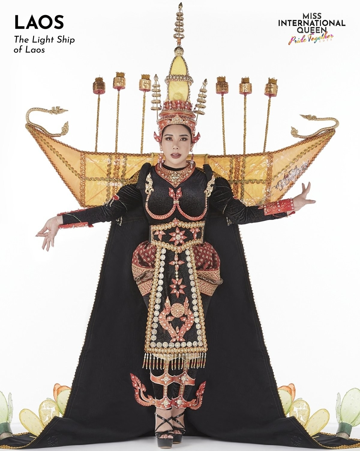 Miss Laos in a black dress with a golden ship back piece