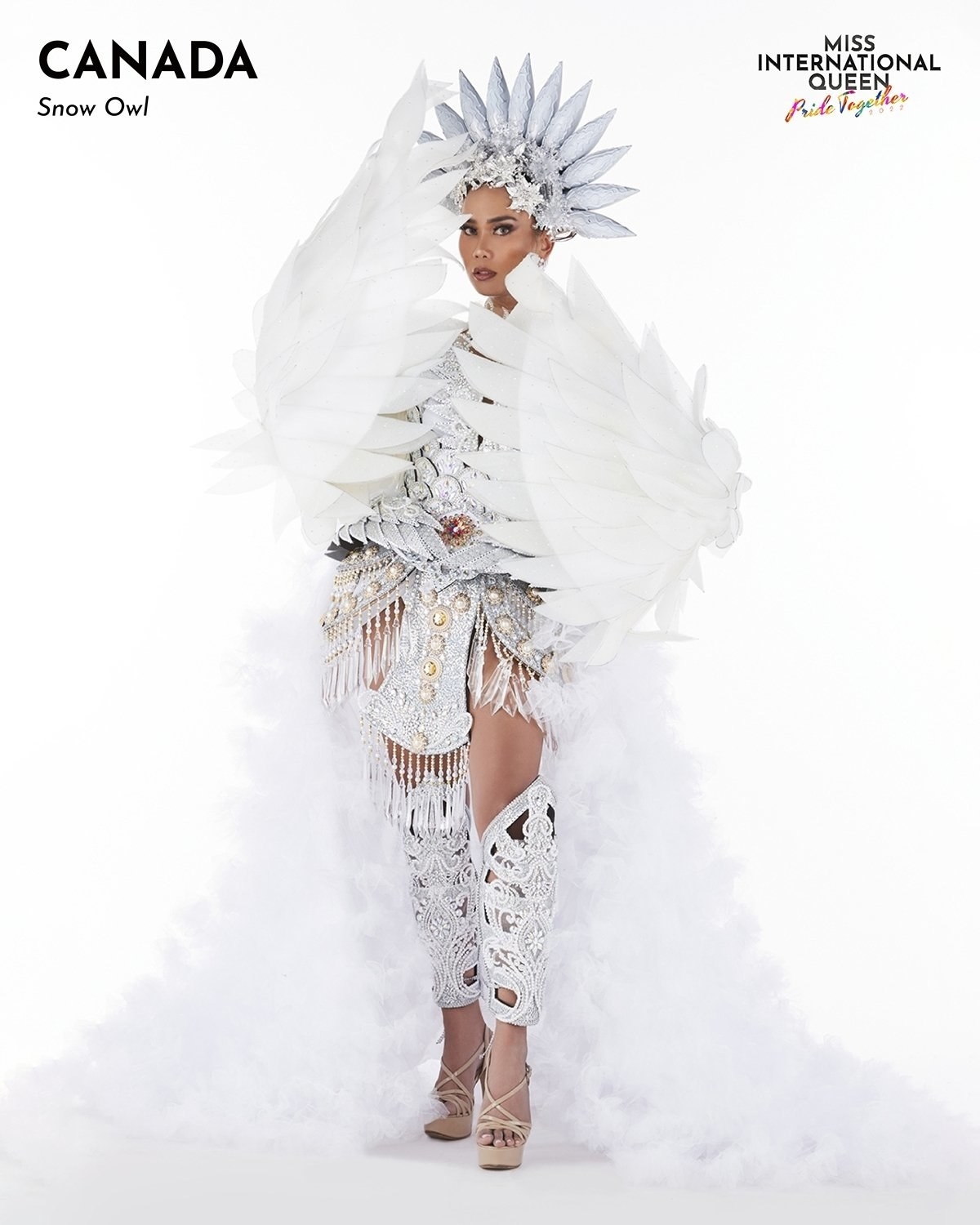 Miss Canada wears white in a snow owl-themed outfit