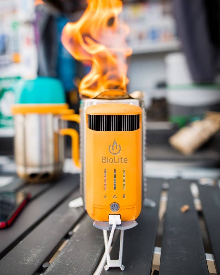 The fired-up camp stove on a picnic table