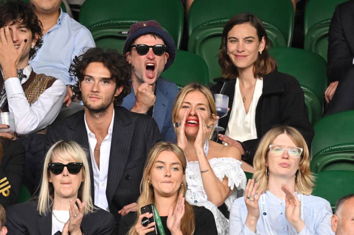 Sienna and her boyfriend sit in the row in front of Tom and his girlfriend