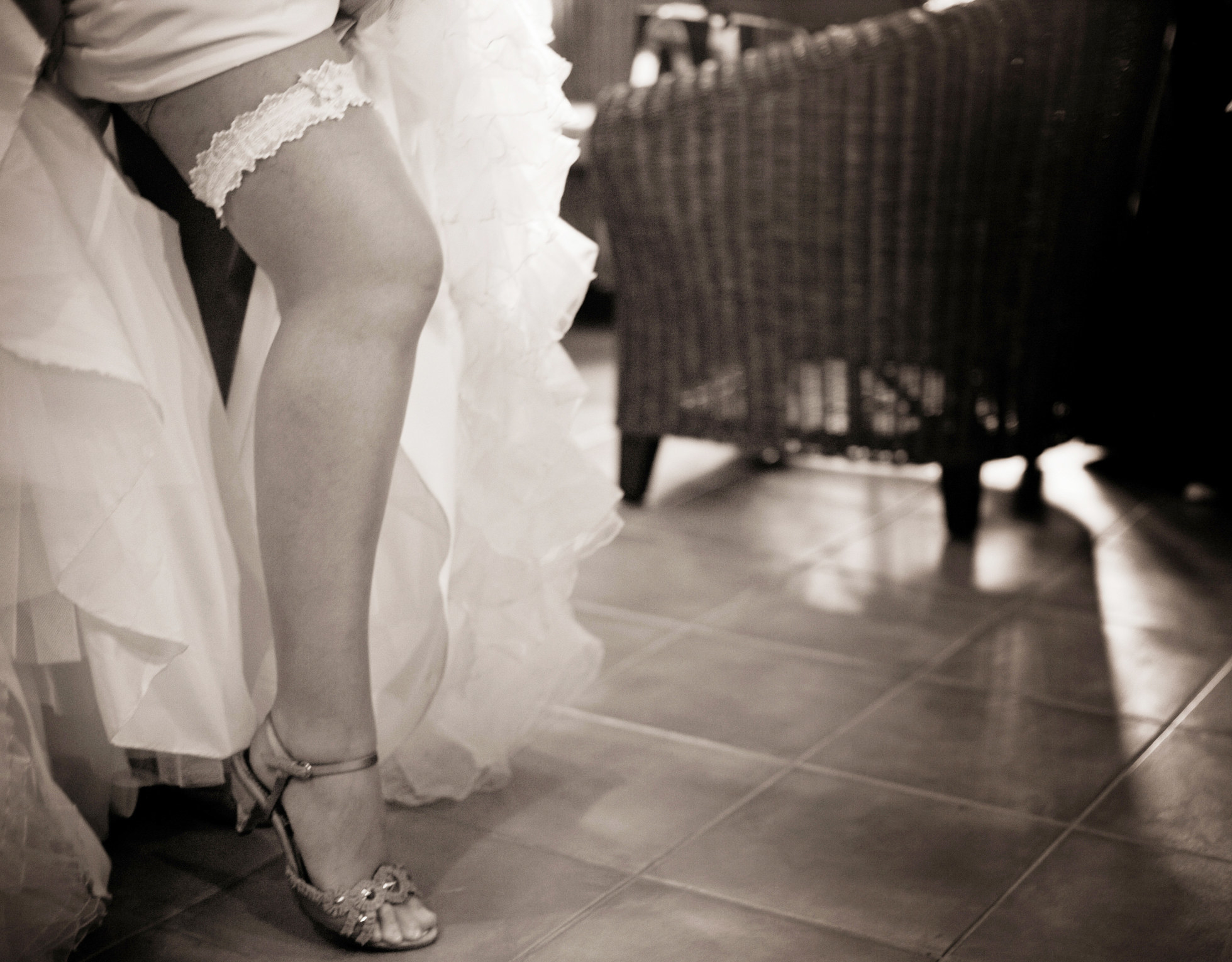 A bride flashing the garter on her leg