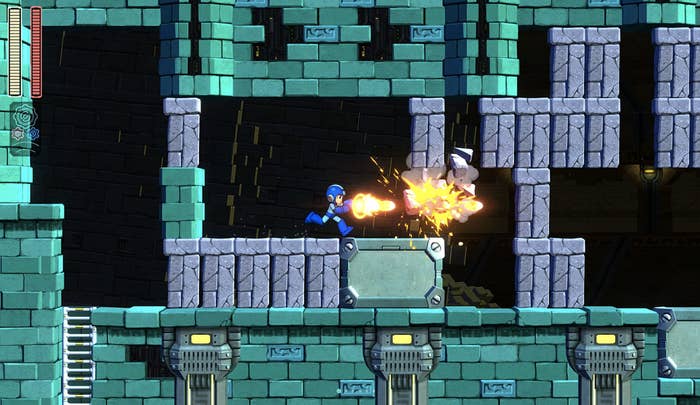 A screenshot from the &quot;Mega Man&quot; game of Mega Man shooting to blow open walls