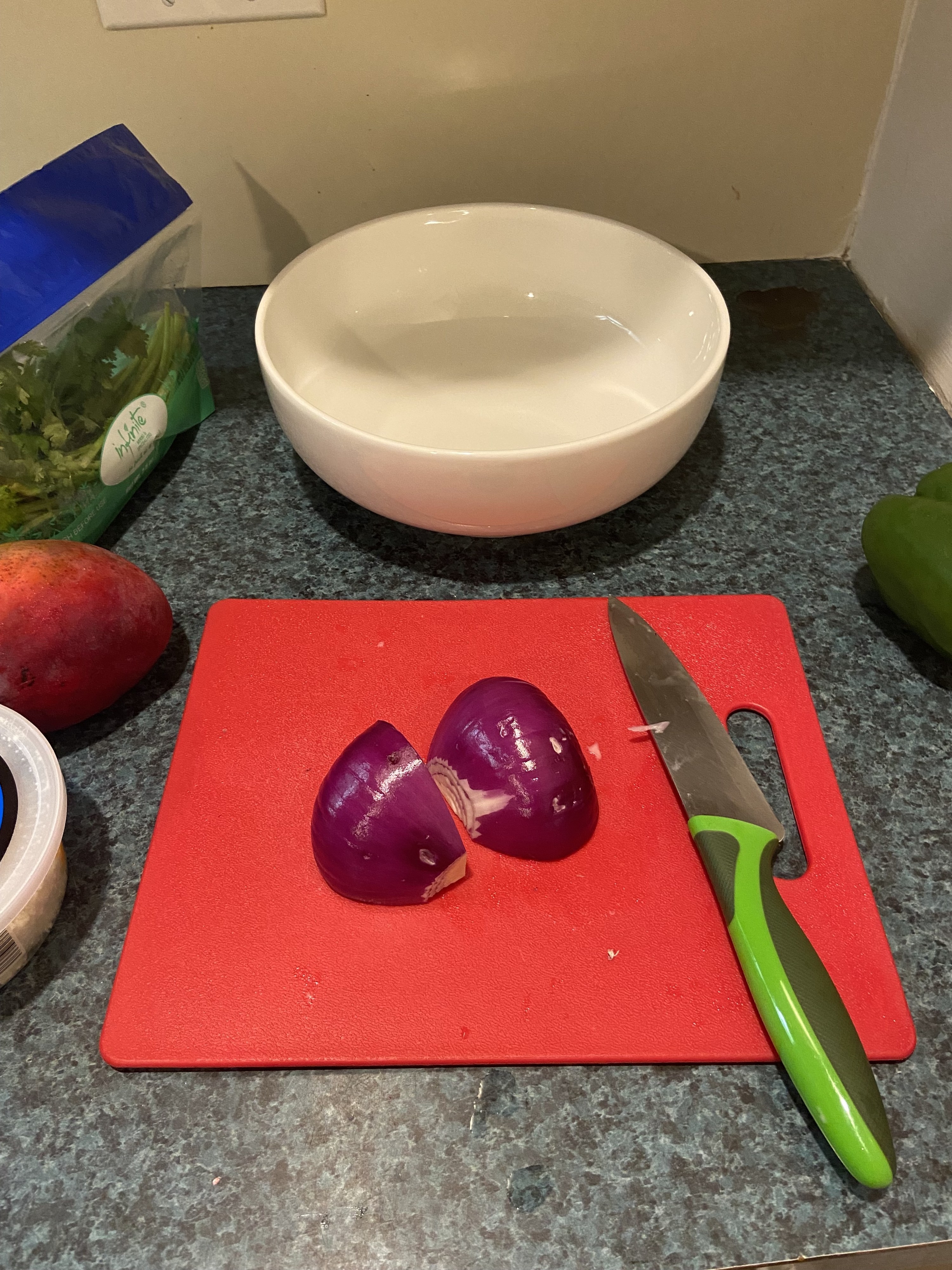 A red onion on a cutting board