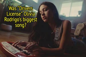 Olivia Rodrigo plays a toy piano while lying on the floor