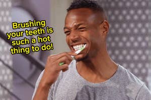 A close up of Marlon Waynes brushing his teeth