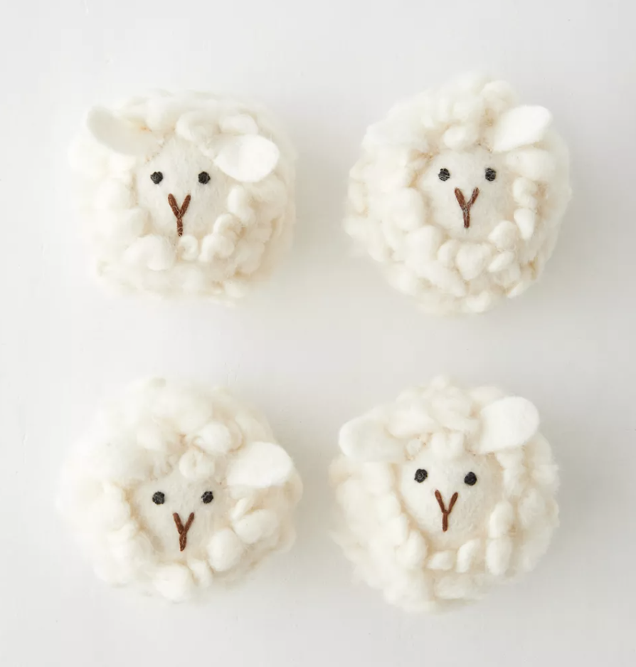 a set of four sheep shaped dryer balls