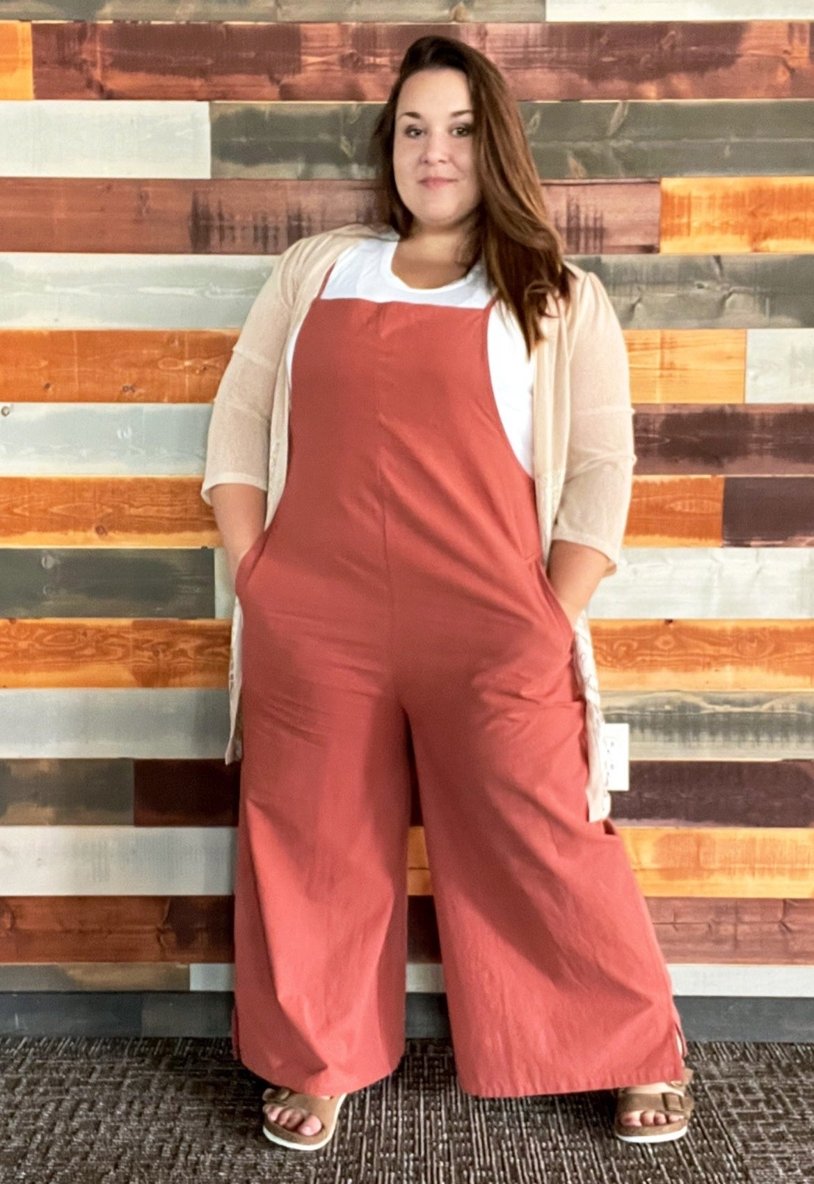 a reviewer wearing the jumpsuit in red