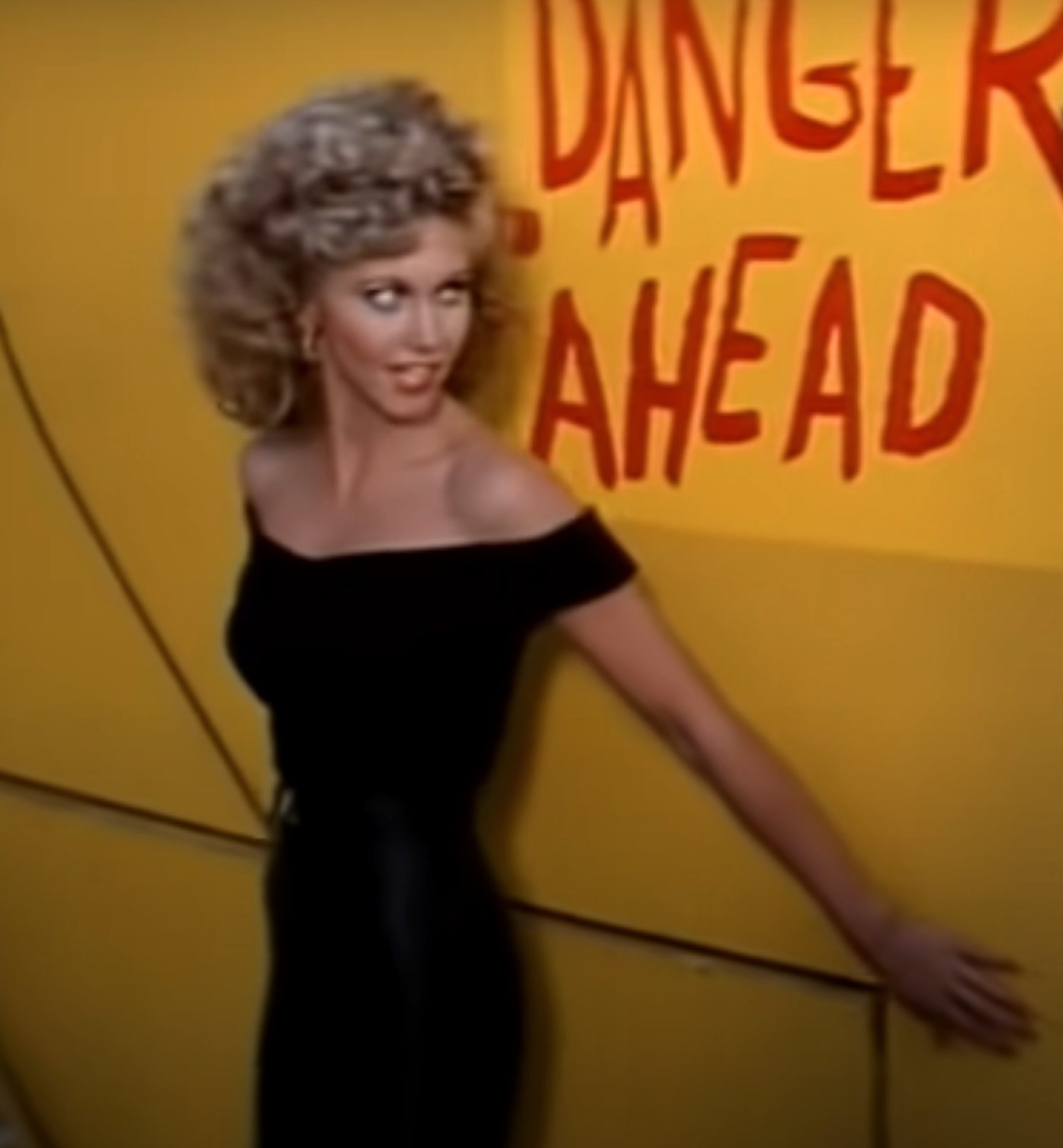 Olivia Newton-John as Sandy sings &quot;You&#x27;re The One That I Want&quot; at the end-of-the-year school carnival
