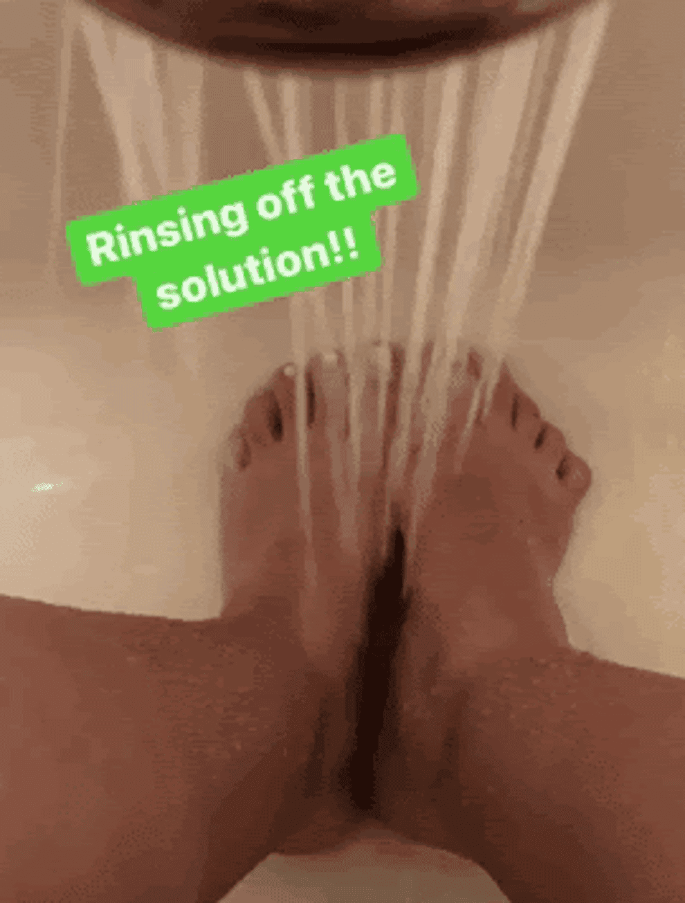 a gif of Bianca rinsing her feet off with water in a shower
