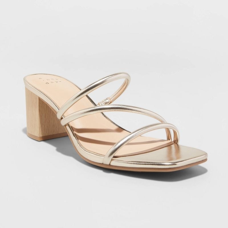 A pair of gold strappy sandals
