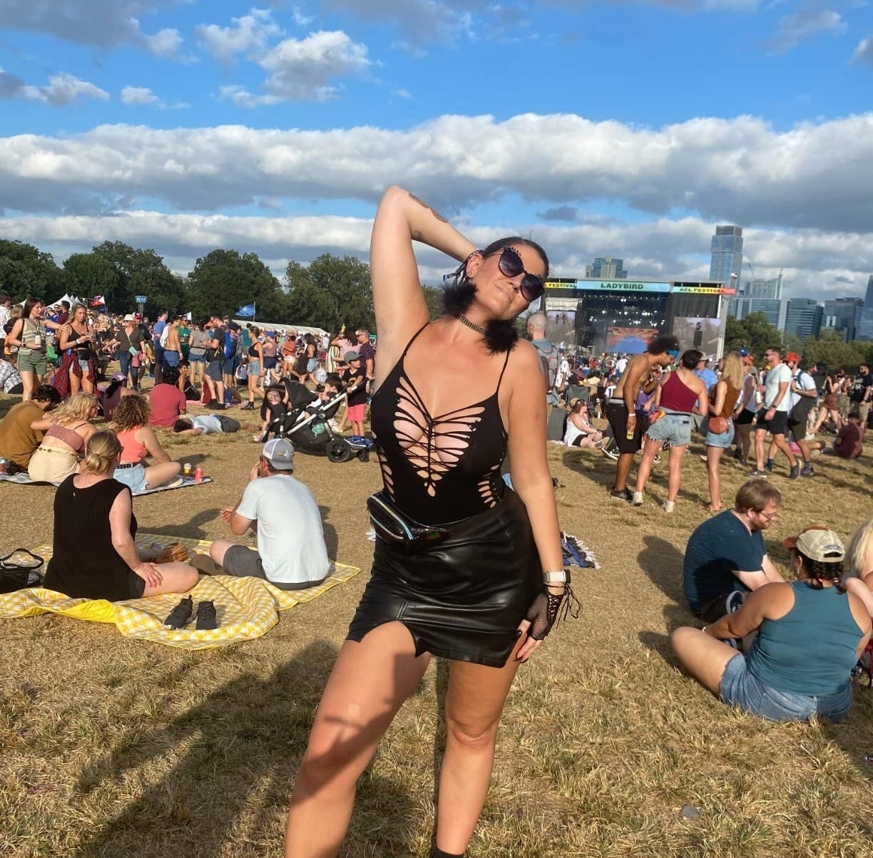 reviewer wearing the black skirt at a music festival