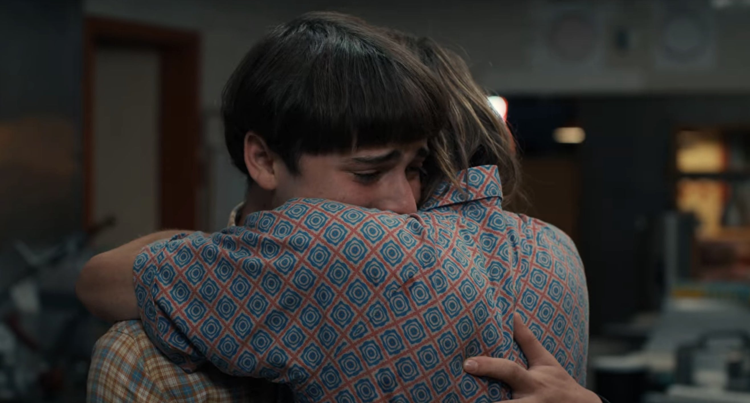 Will and Jonathan hugging in a pizzeria in &quot;Stranger Things&quot;