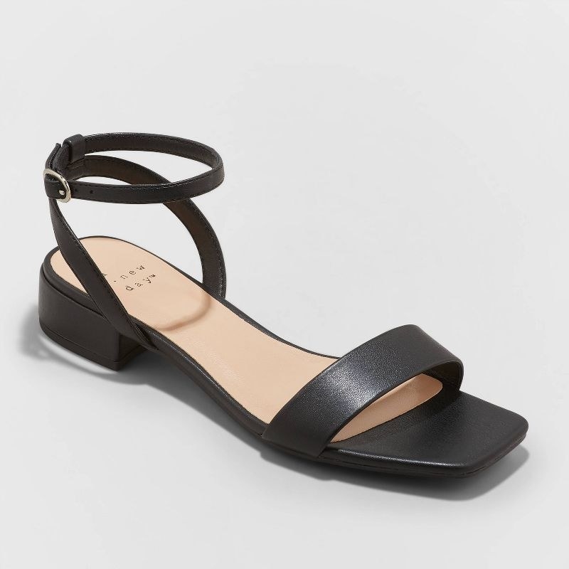 A pair of black chunky sandals