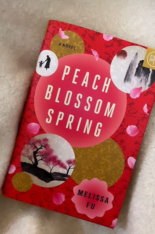 &quot;Peach Blossom Spring&quot; by Melissa Fu on a blanket.