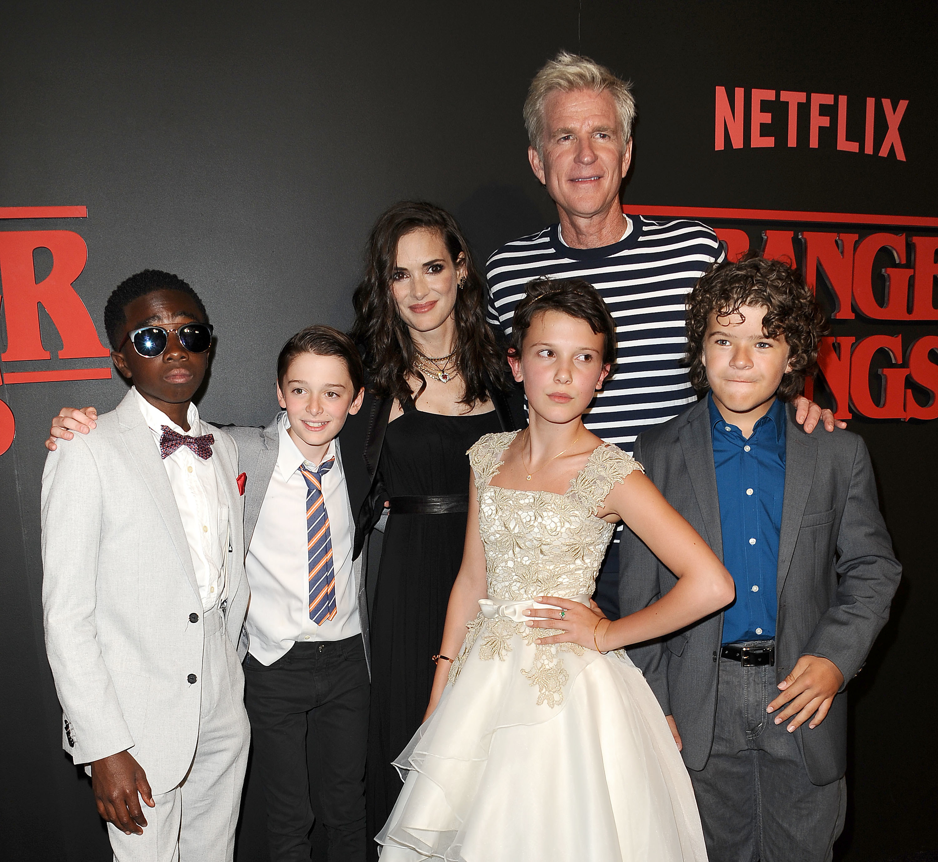 Photo shows the cast back in 2016 when season 1 filmed, all looking very young! The photo includes Caleb McLaughlin (Lucas), Noah Schnapp (Will), Winona Ryder (Joyce), Matthew Modine (Brenner), Millie Bobby Brown (Eleven), and Gaten Matarazzo (Dustin)