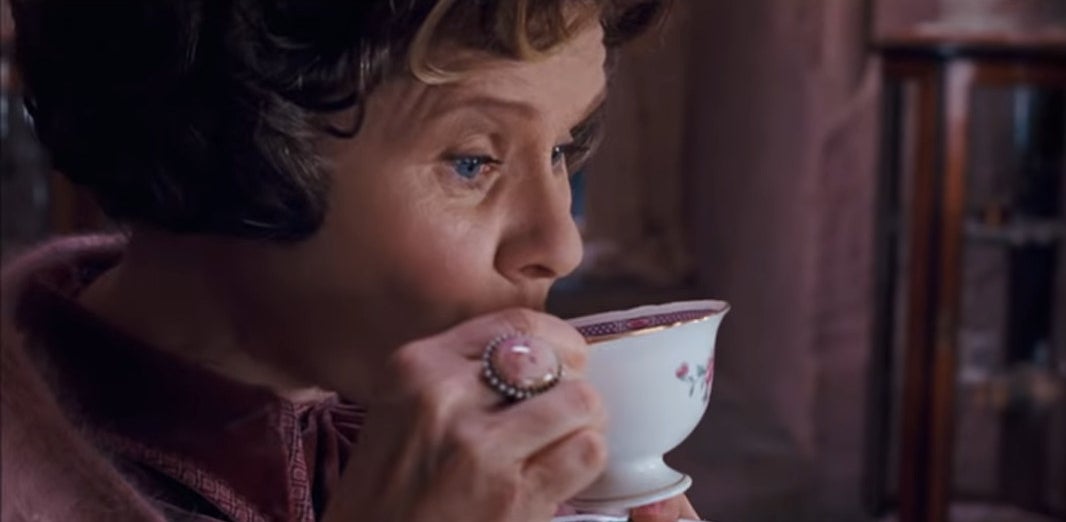 Dolores Umbridge from Harry Potter sipping tea