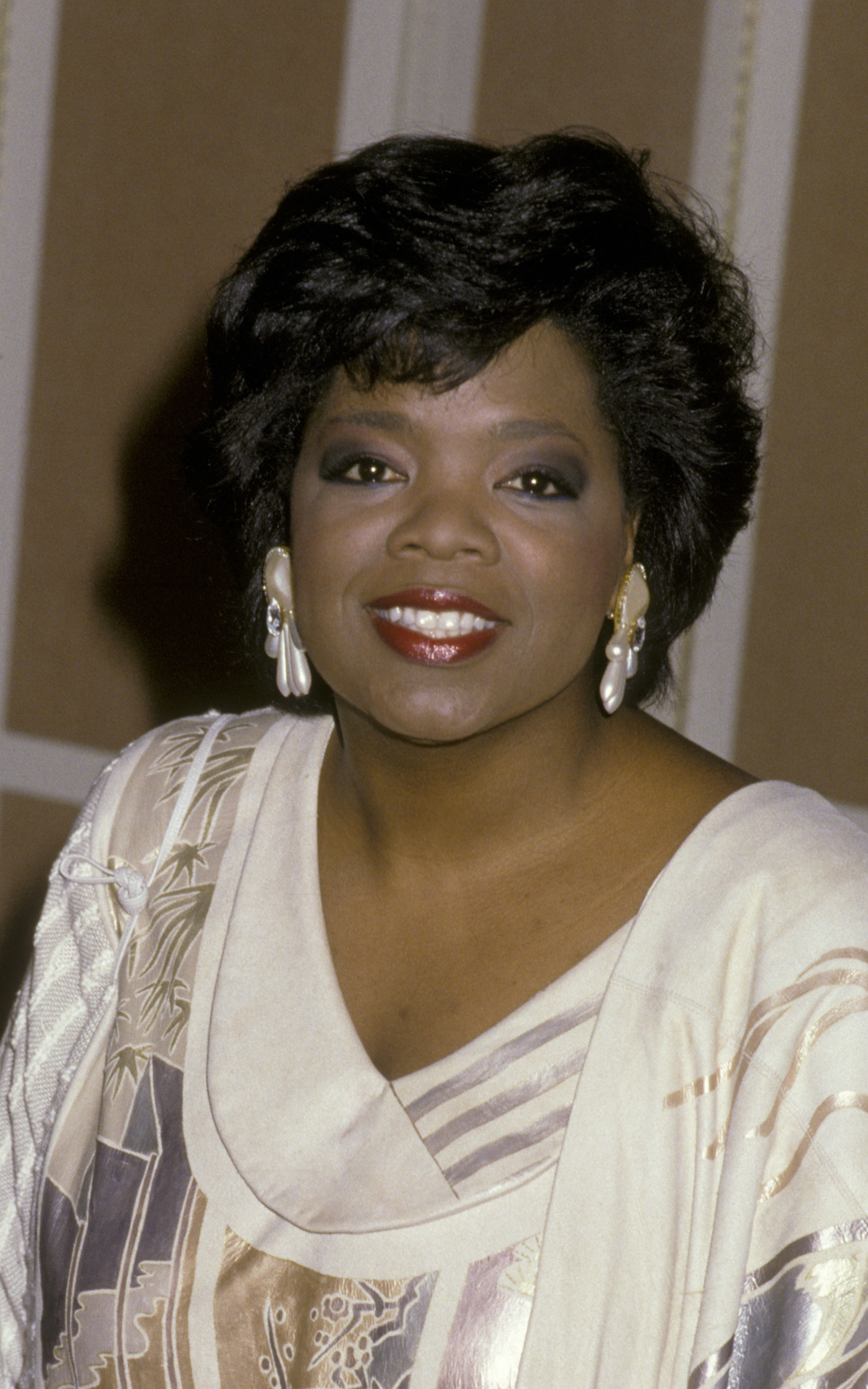Oprah Winfrey poses at an Academy Awards luncheon in 1986