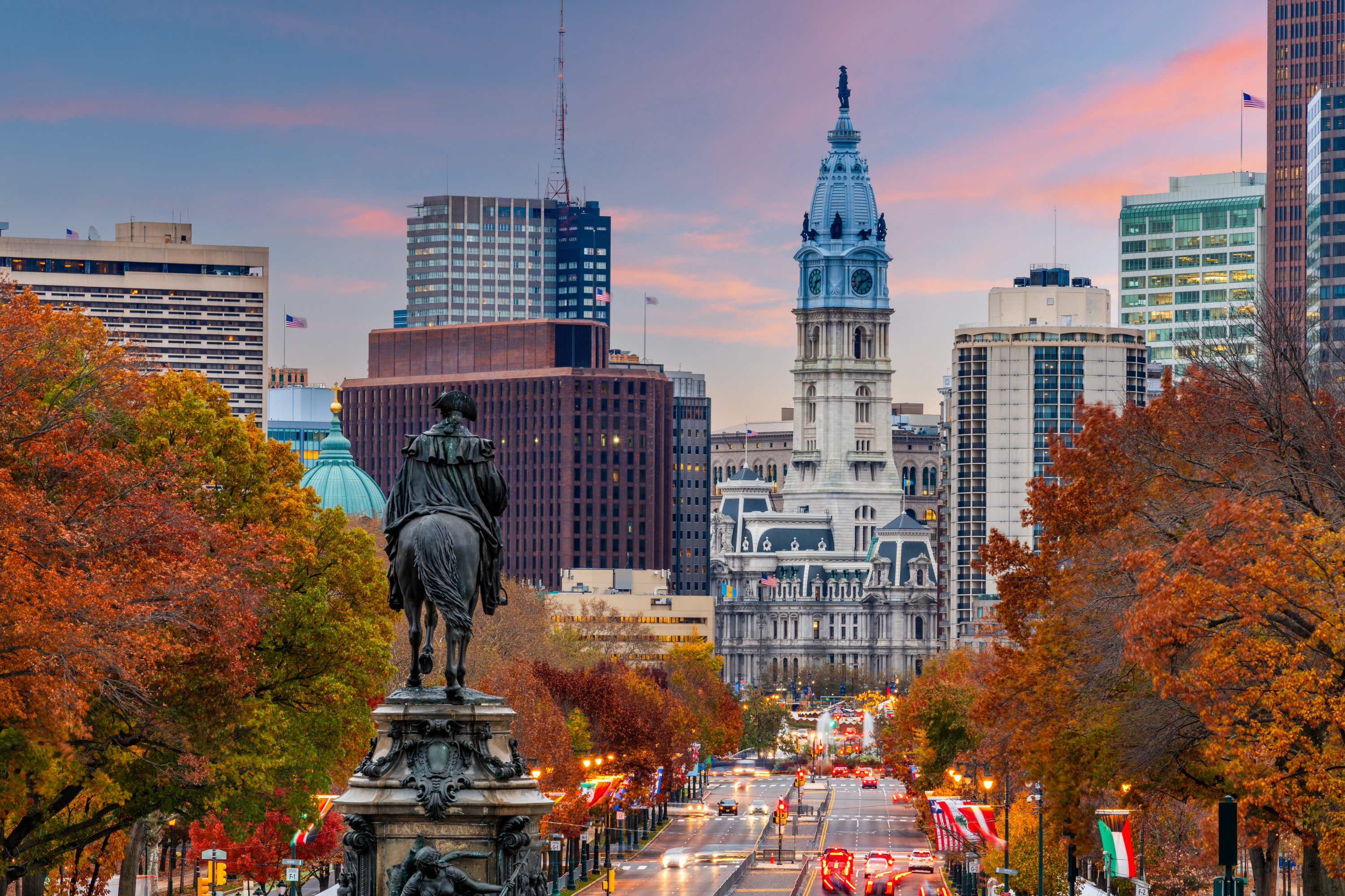 city view with tall buildings and statues