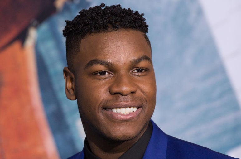 John Boyega, smiling, arrives at Universal&#x27;s &quot;Pacific Rim Uprising&quot; premiere at TCL Chinese Theatre