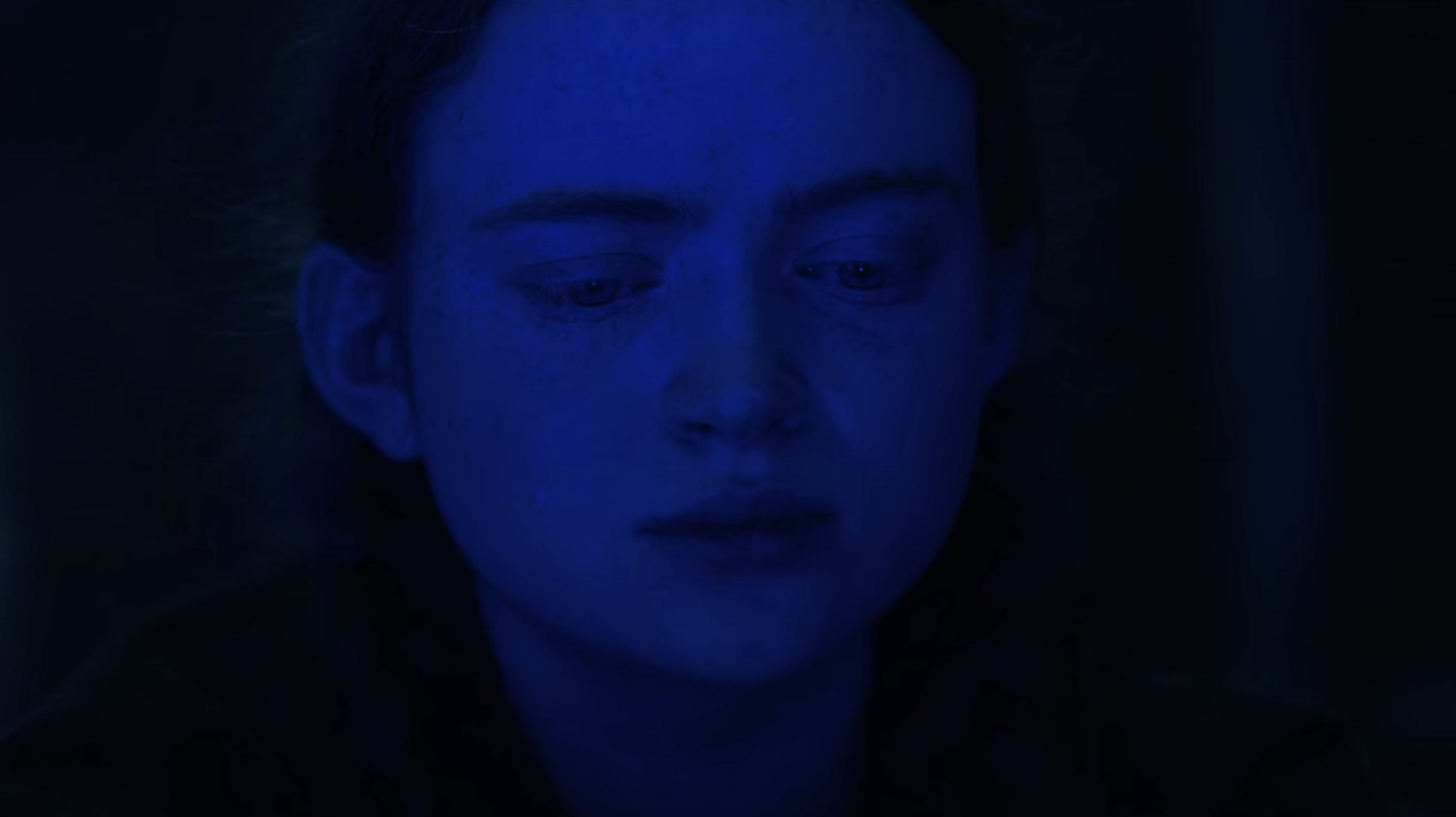 Max with her face illuminated by blue light in &quot;Stranger Things&quot;