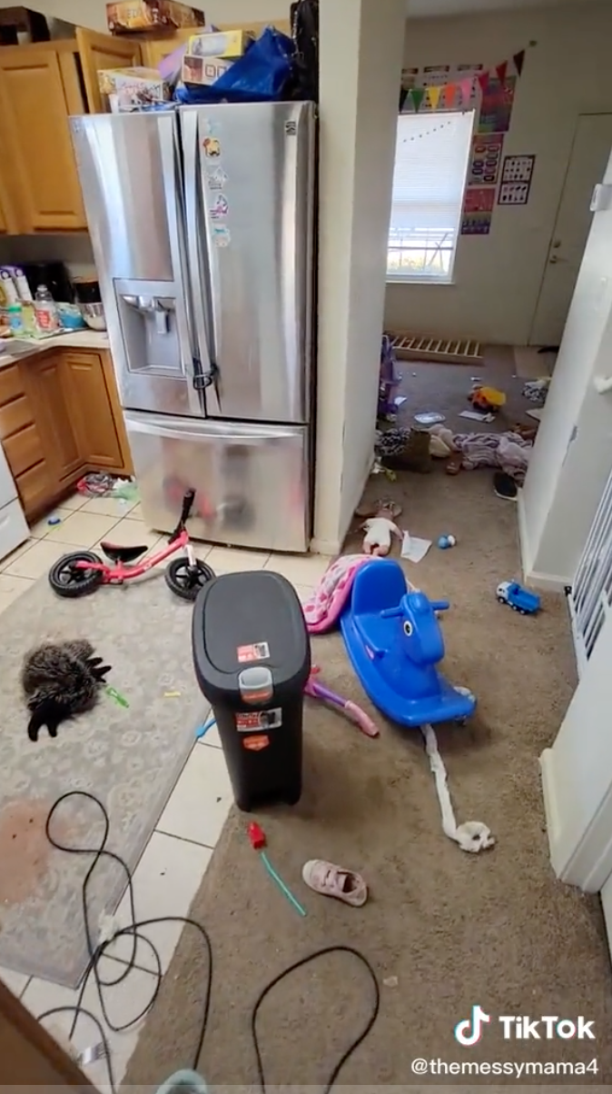 Toys and clothes strewn across the floor