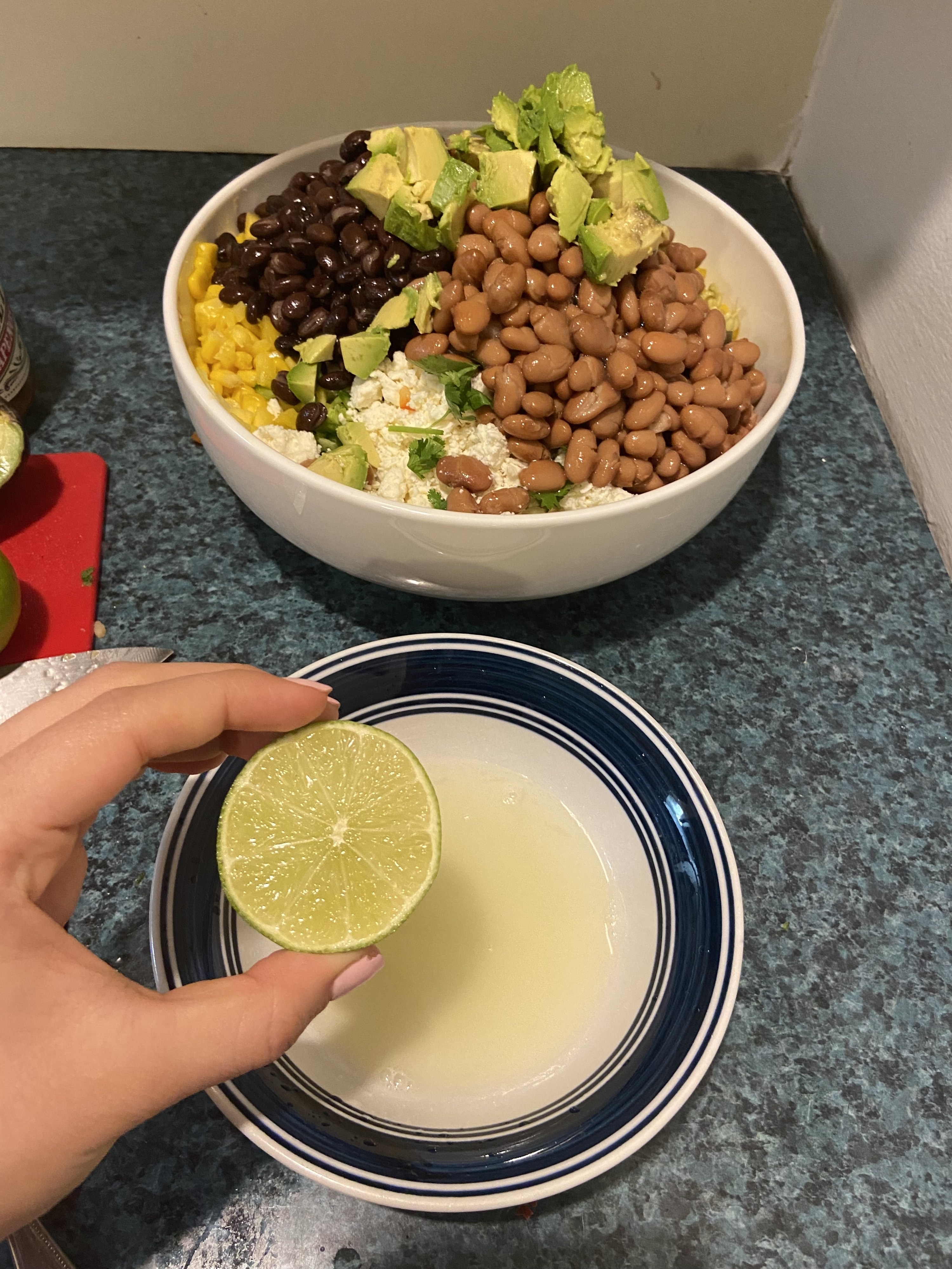 holding a lime over a bowl