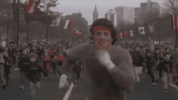 gif of rocky in the movie rocky sprinting in a race