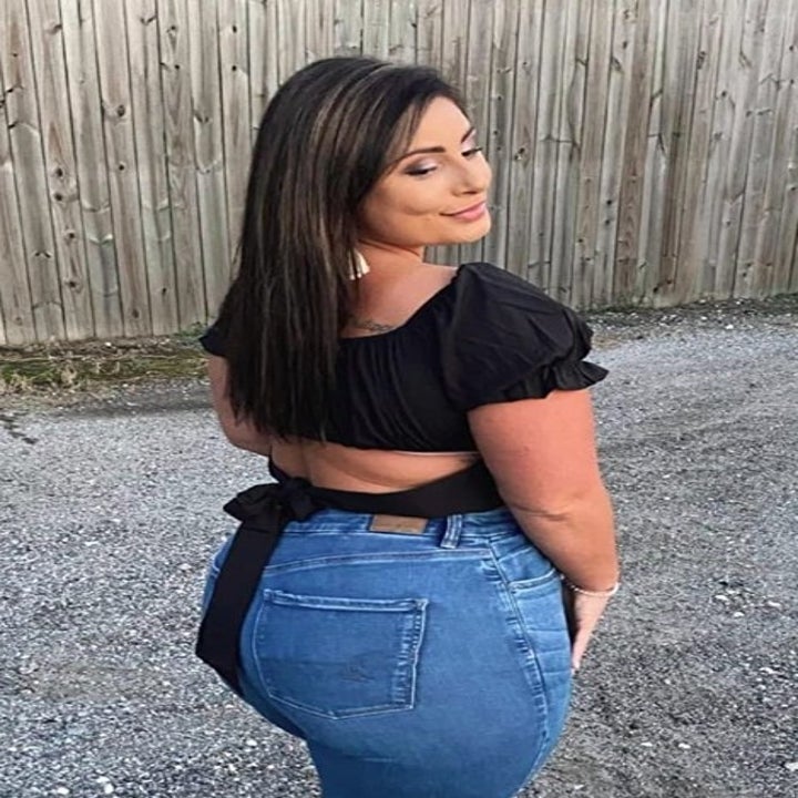 reviewer wearing the black top
